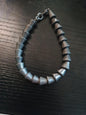 Ancien bracelet cône d'étain lourd